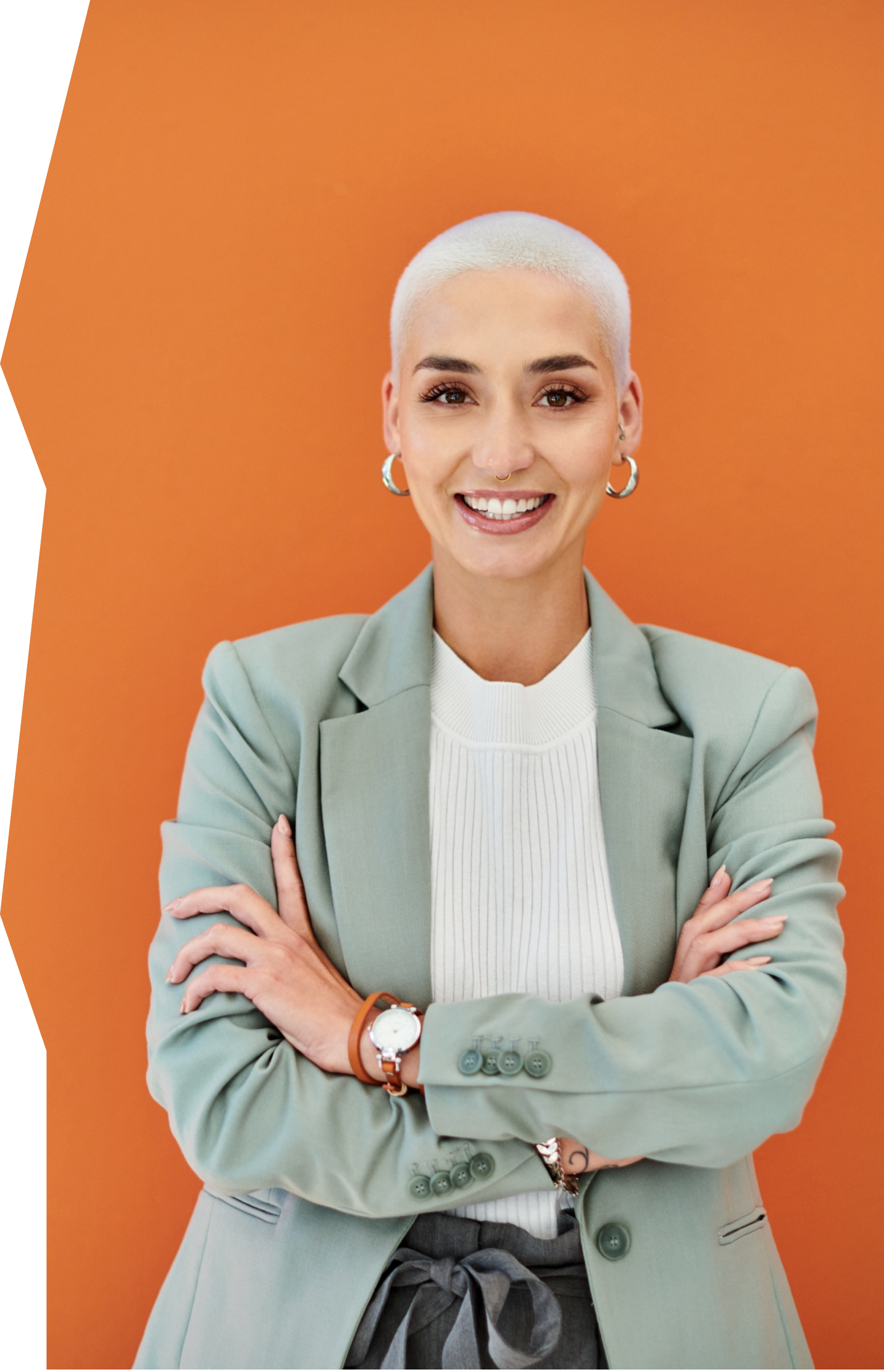 Happy Talent Acquisition Professional by an orange wall